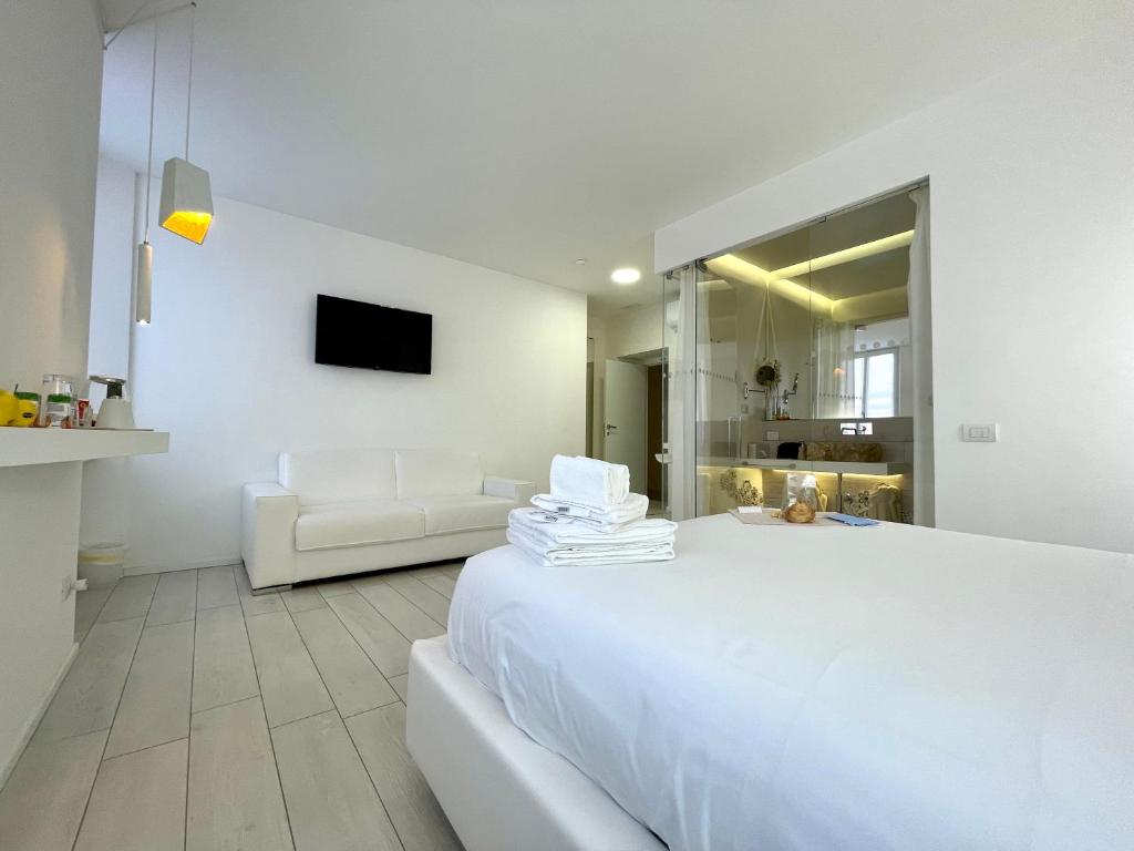 Posteľ alebo postele v izbe v ubytovaní Mariarosa Suites