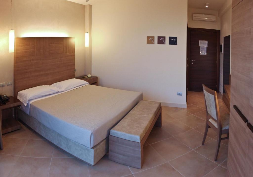 Postel nebo postele na pokoji v ubytování Hotel Vespucci