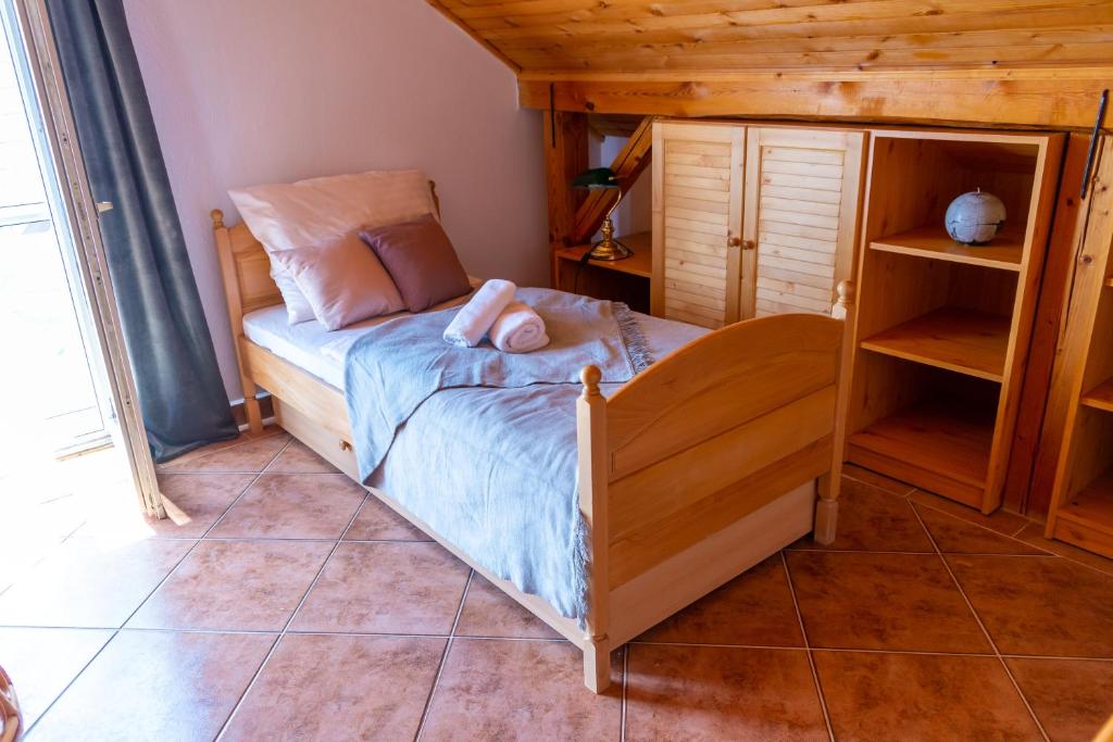 Postel nebo postele na pokoji v ubytování Délibáb Vendégház