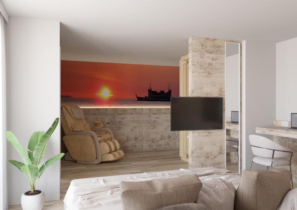 TV a/nebo společenská místnost v ubytování Hotel Ambassador