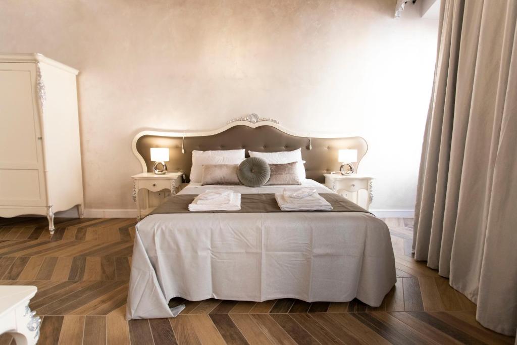 Posteľ alebo postele v izbe v ubytovaní Palazzo Fracassini