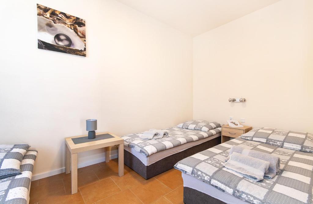 Postel nebo postele na pokoji v ubytování Oasis