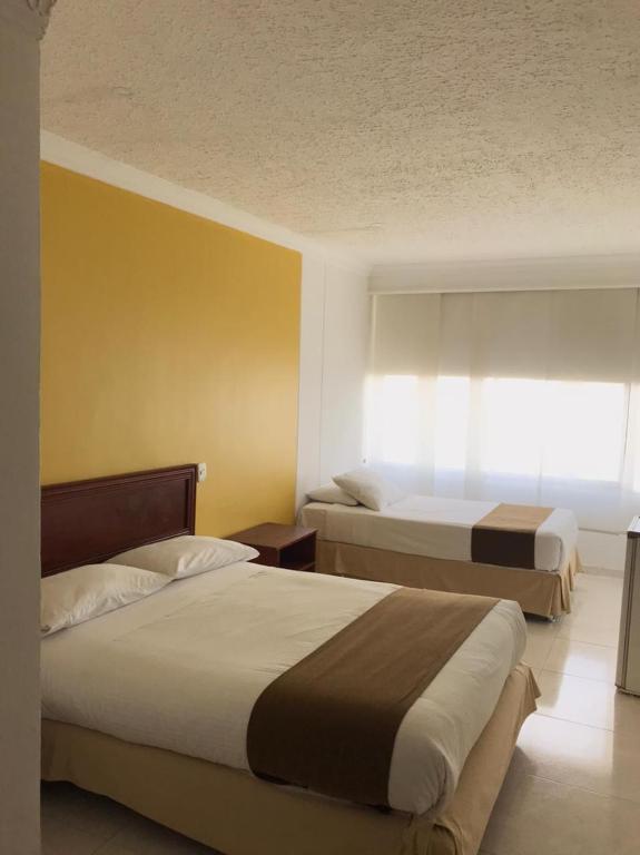 Postel nebo postele na pokoji v ubytování Vajamar Hotel