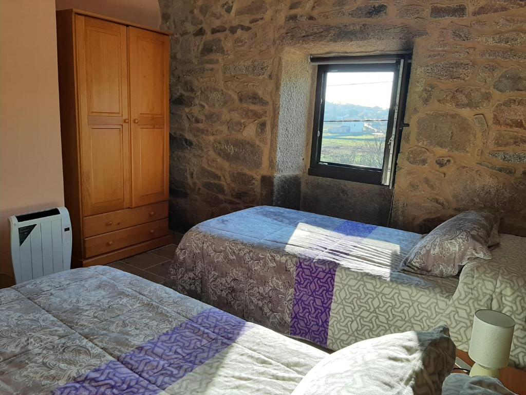 Postel nebo postele na pokoji v ubytování Casita de norma