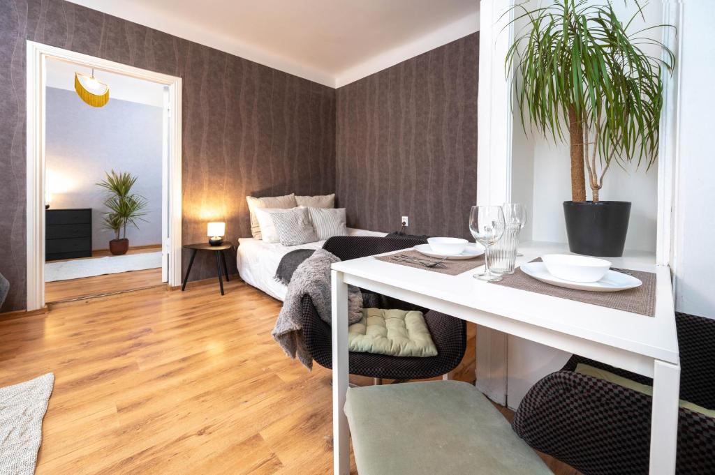 a living room with a bed and a dining table at Cosy place for friends & families in Tallinn