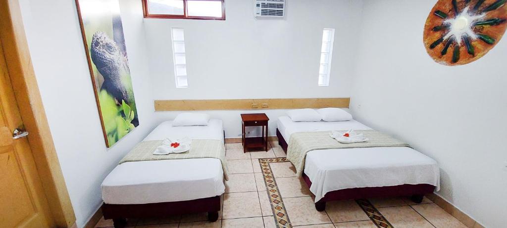 Postel nebo postele na pokoji v ubytování Hotel Crossman