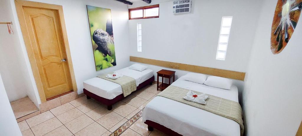 Postel nebo postele na pokoji v ubytování Hotel Crossman