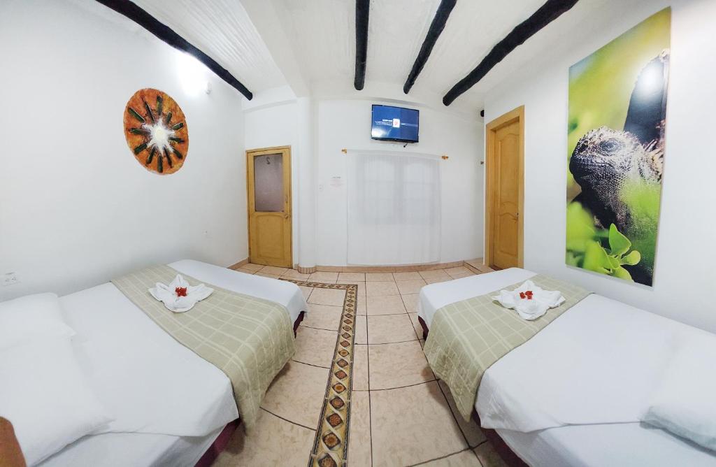Postel nebo postele na pokoji v ubytování Hotel Crossman