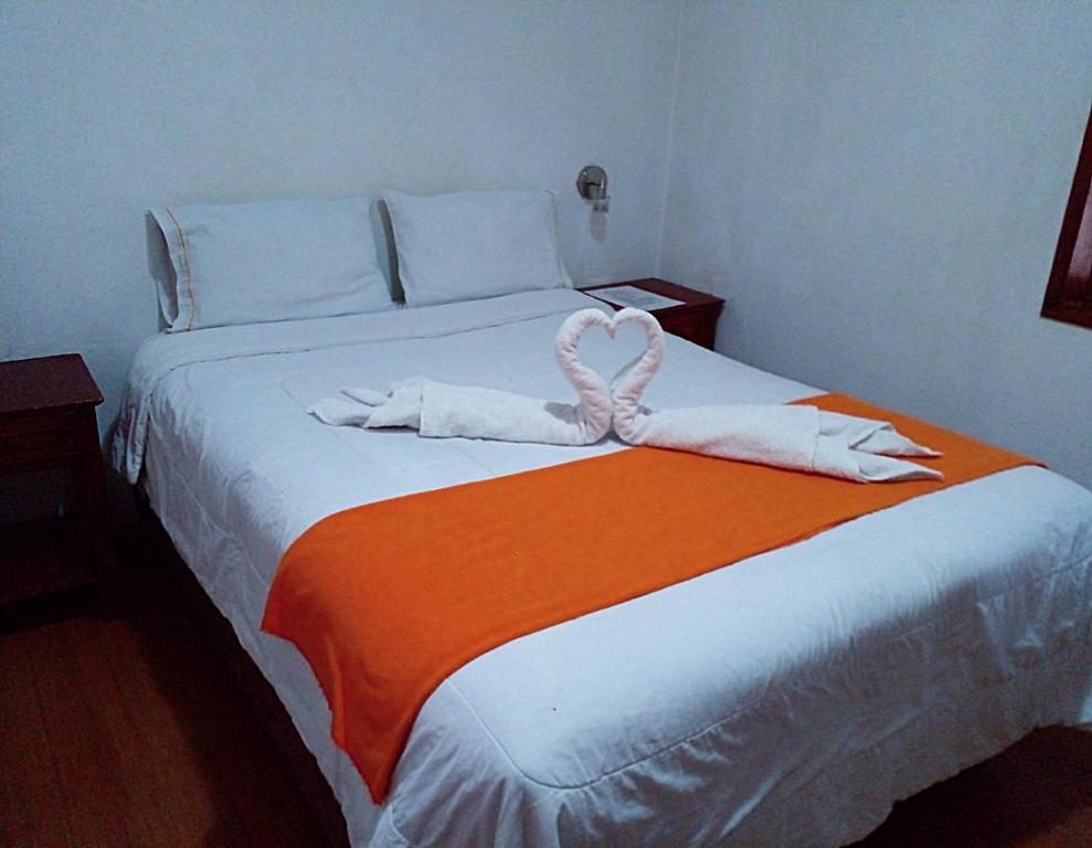 Letto o letti in una camera di Hostal Tu Hogar