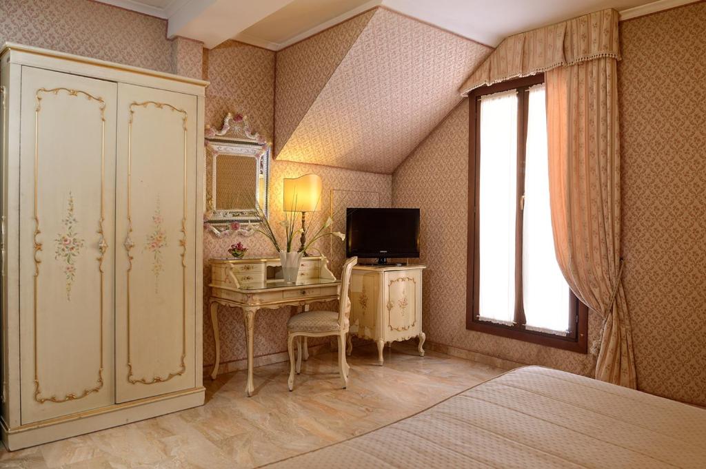 TV a/nebo společenská místnost v ubytování Hotel Canaletto