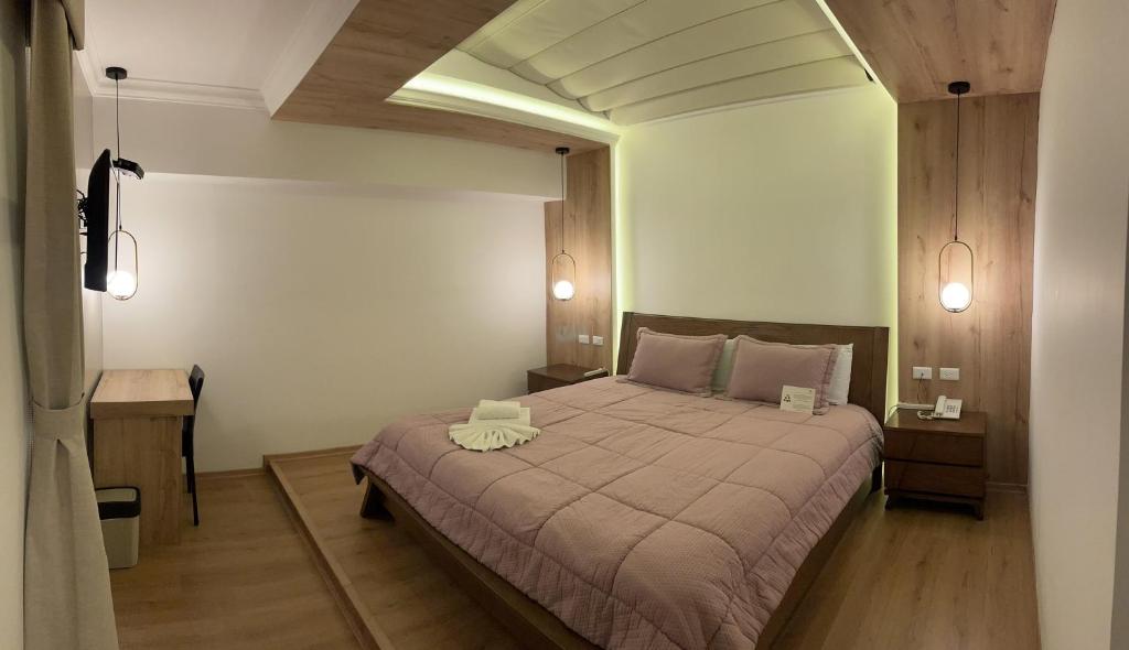 Postel nebo postele na pokoji v ubytování Hotel Shalom
