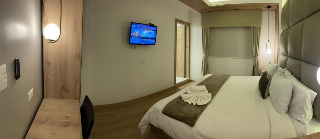 Postel nebo postele na pokoji v ubytování Hotel Shalom