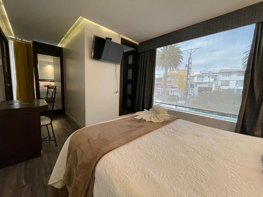 Postel nebo postele na pokoji v ubytování Hotel Shalom