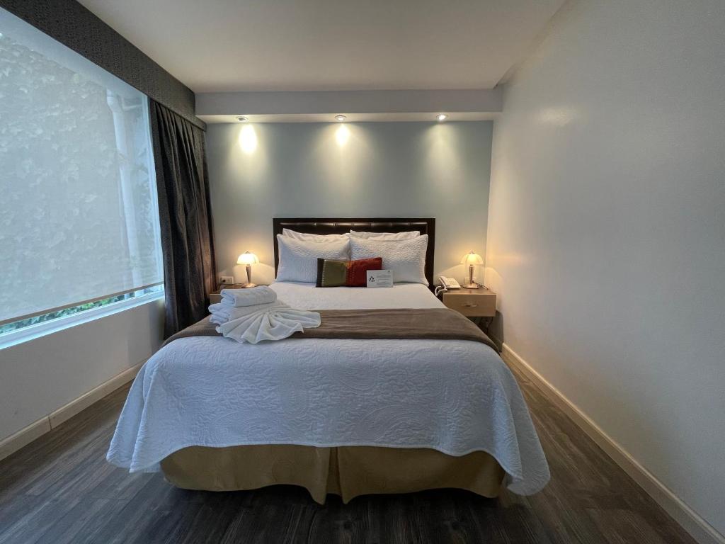 Postel nebo postele na pokoji v ubytování Hotel Shalom