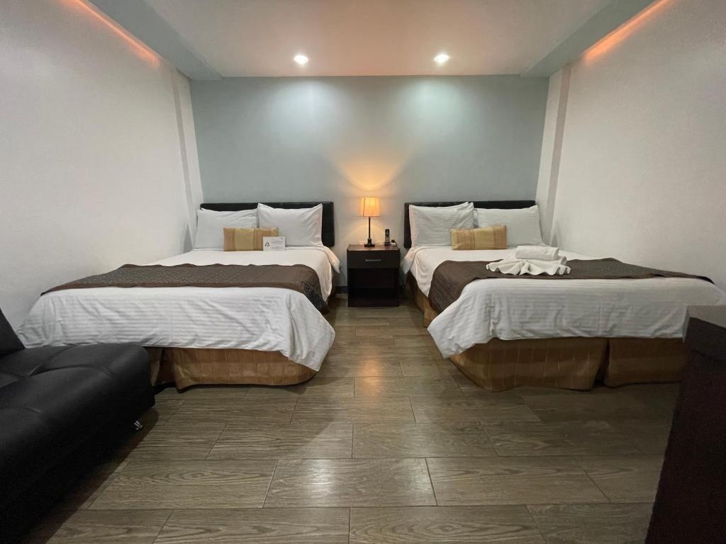 Postel nebo postele na pokoji v ubytování Hotel Shalom