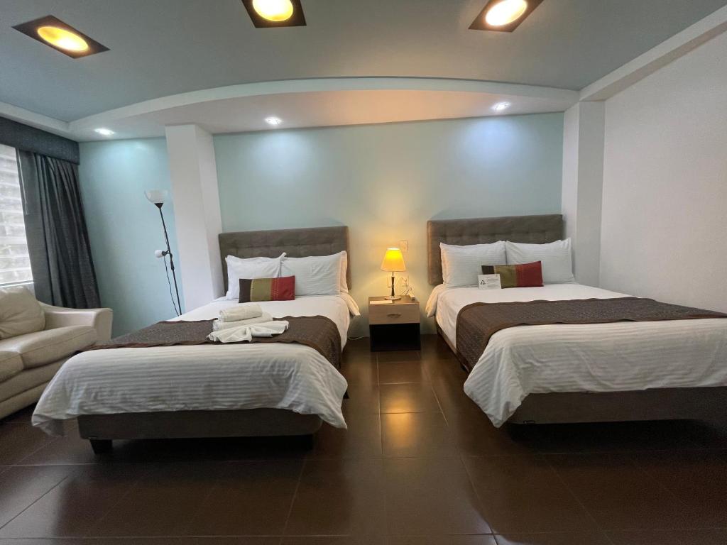 Postel nebo postele na pokoji v ubytování Hotel Shalom