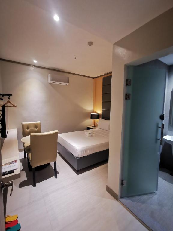 Postel nebo postele na pokoji v ubytování Yes Hotel Pandi Bulacan