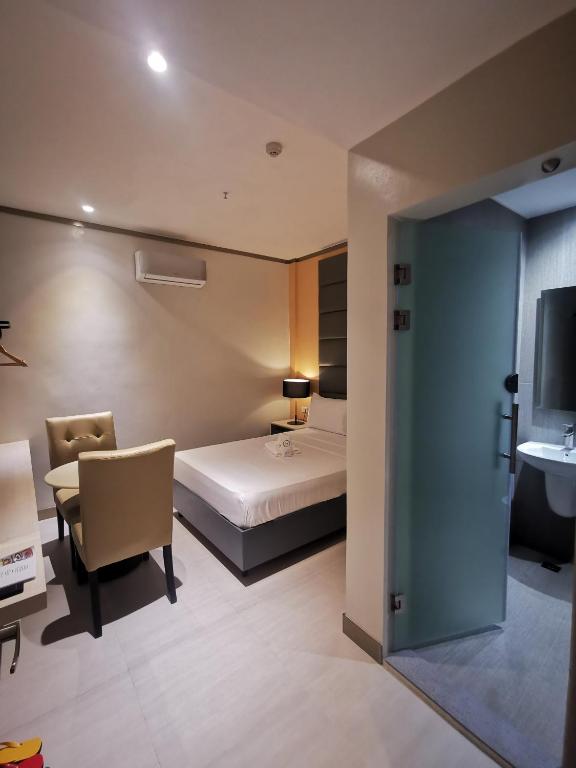Postel nebo postele na pokoji v ubytování Yes Hotel Pandi Bulacan