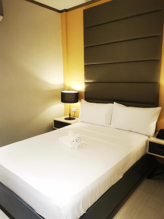 Postel nebo postele na pokoji v ubytování Yes Hotel Pandi Bulacan