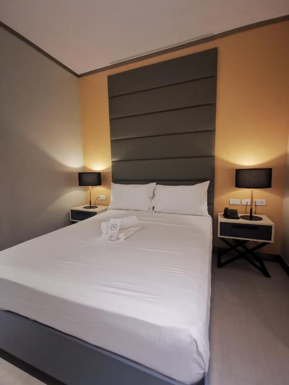 Postel nebo postele na pokoji v ubytování Yes Hotel Pandi Bulacan