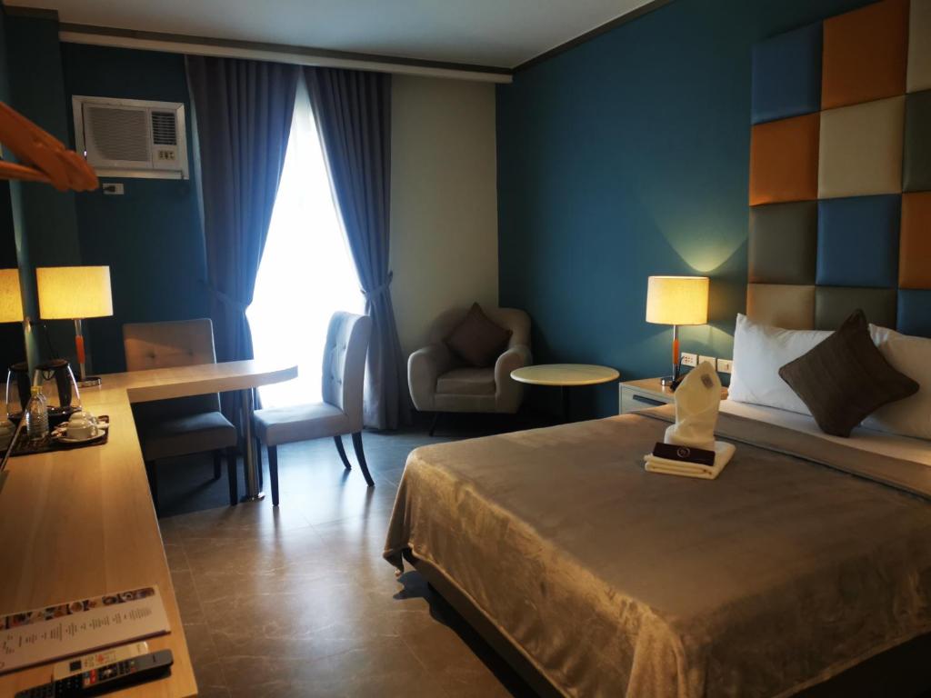 Postel nebo postele na pokoji v ubytování Yes Hotel Pandi Bulacan