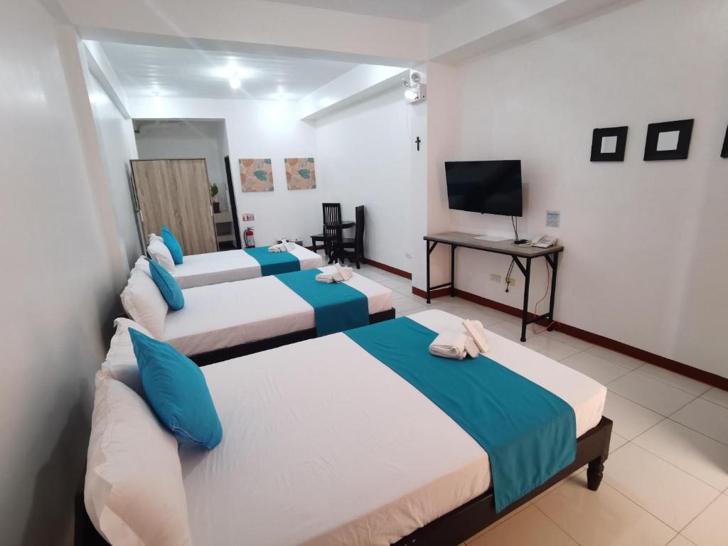 Postel nebo postele na pokoji v ubytování JPrime Apartelle