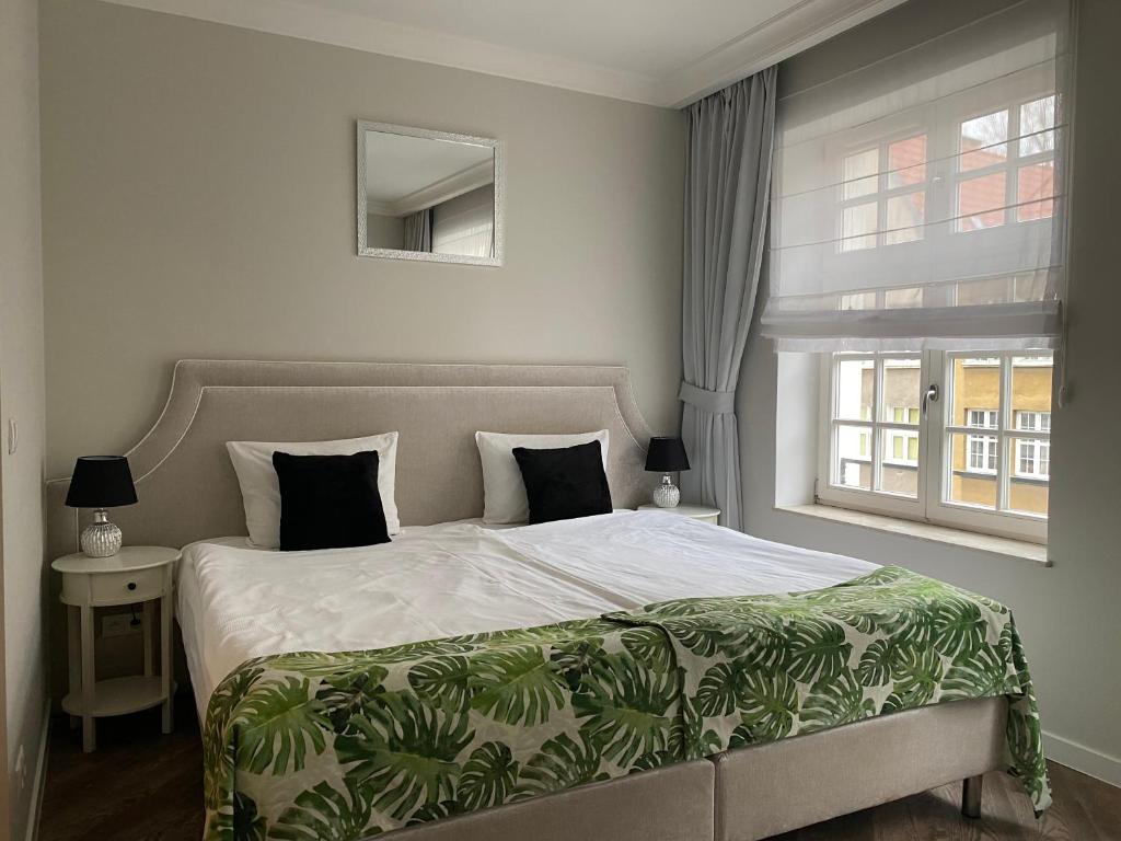 Postel nebo postele na pokoji v ubytování Lavoo Boutique Apartments