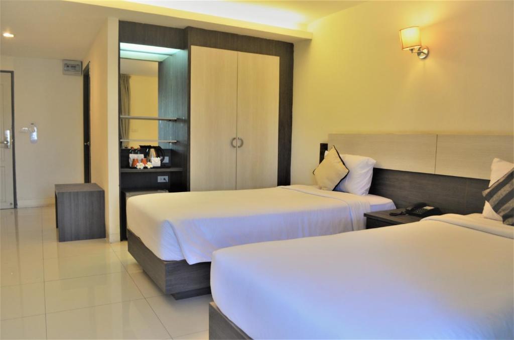 Postel nebo postele na pokoji v ubytování The Zen Hotel Pattaya