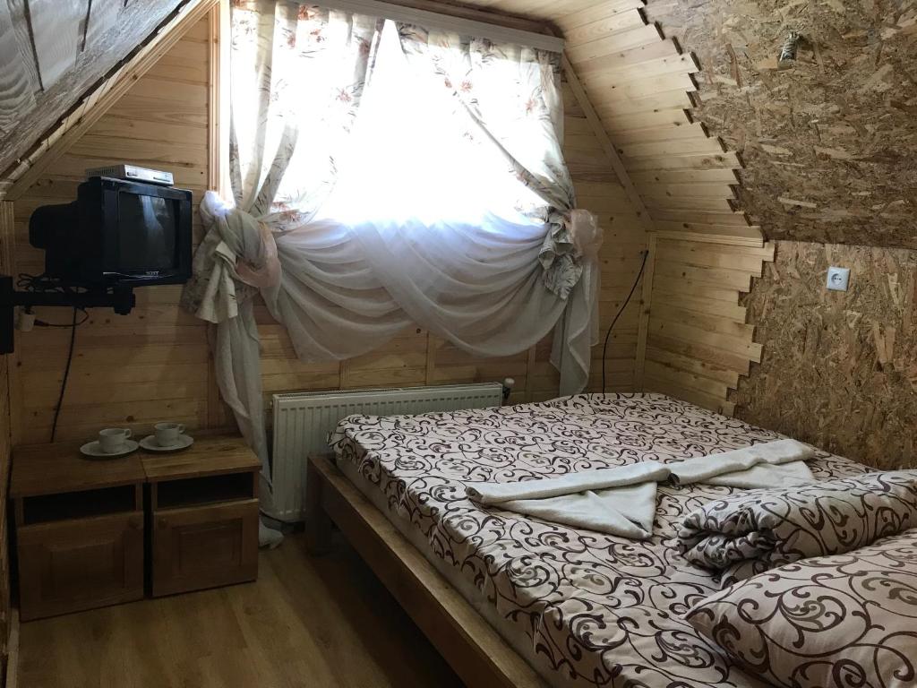 Postel nebo postele na pokoji v ubytování Садиба 2 Підкова чан та сауна