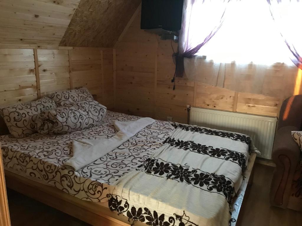 Postel nebo postele na pokoji v ubytování Садиба 2 Підкова чан та сауна