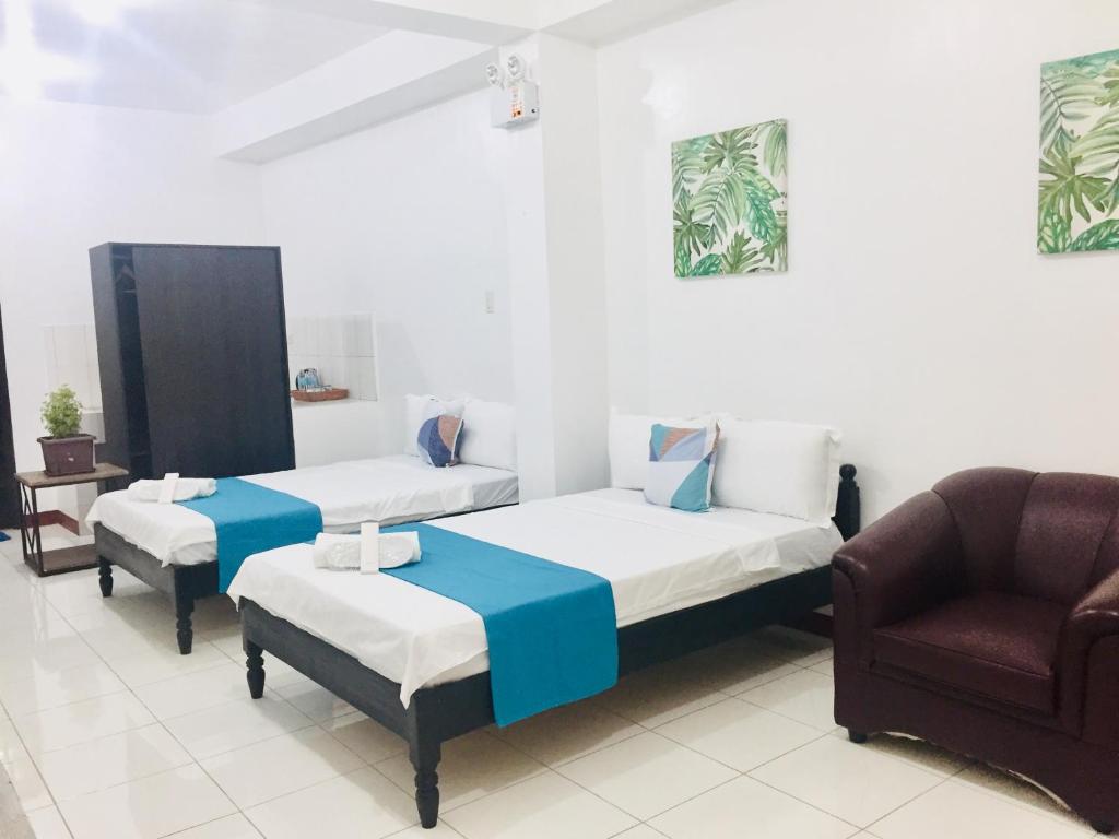 Postel nebo postele na pokoji v ubytování JPrime Apartelle