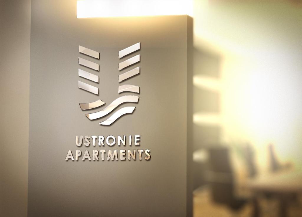 a sign for a museum of appliances with the textulous appliances at Ustronie Apartments z widokiem na morze 20 m do plaży in Ustronie Morskie