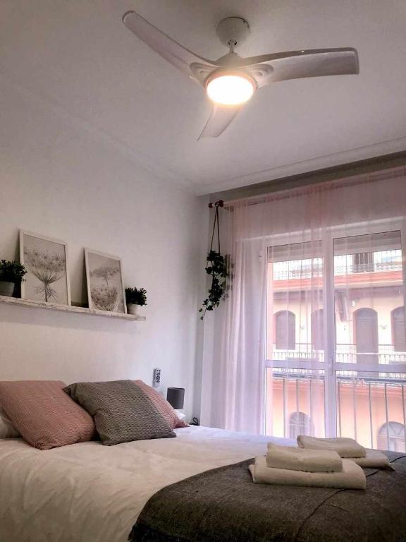 A bed or beds in a room at Apartamento Callao
