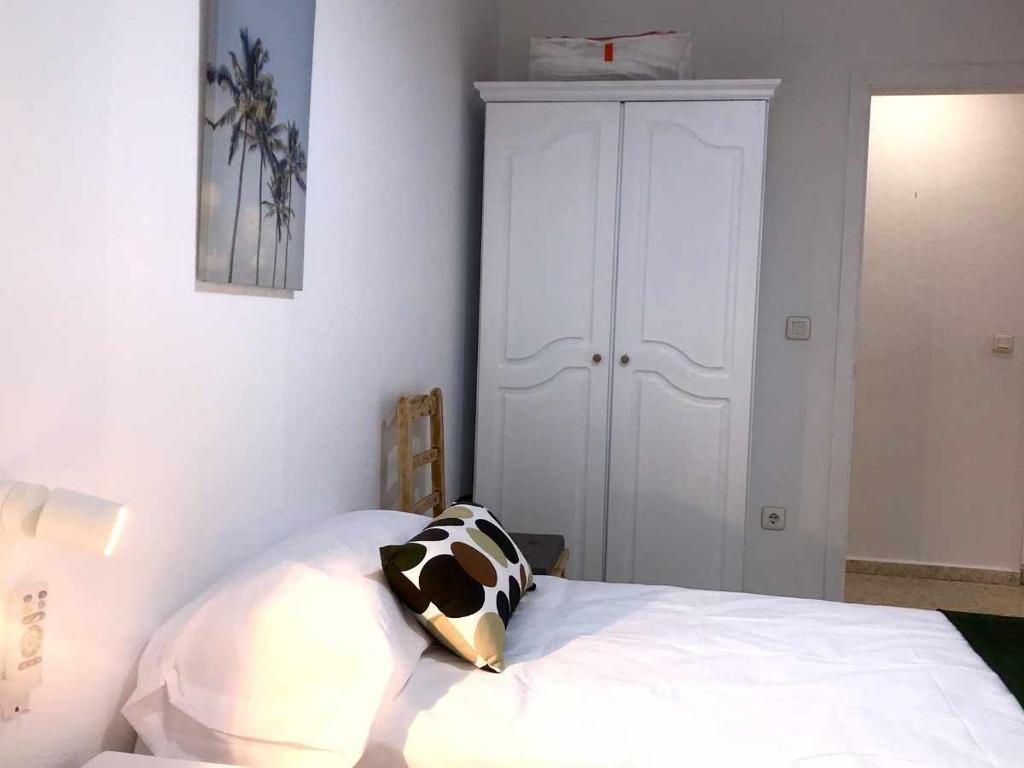 A bed or beds in a room at Apartamento Callao
