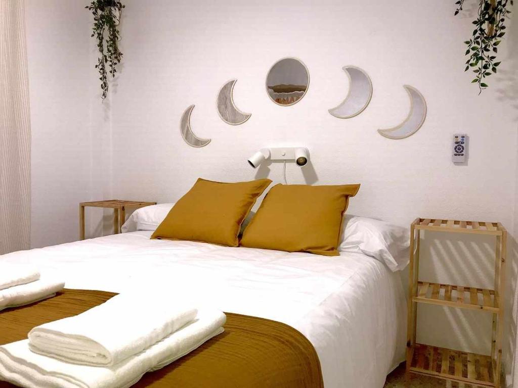 A bed or beds in a room at Apartamento Callao