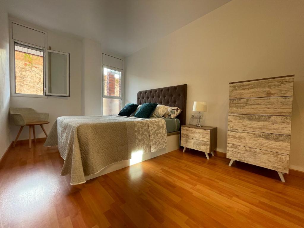 Posteľ alebo postele v izbe v ubytovaní Tarraco Apartment