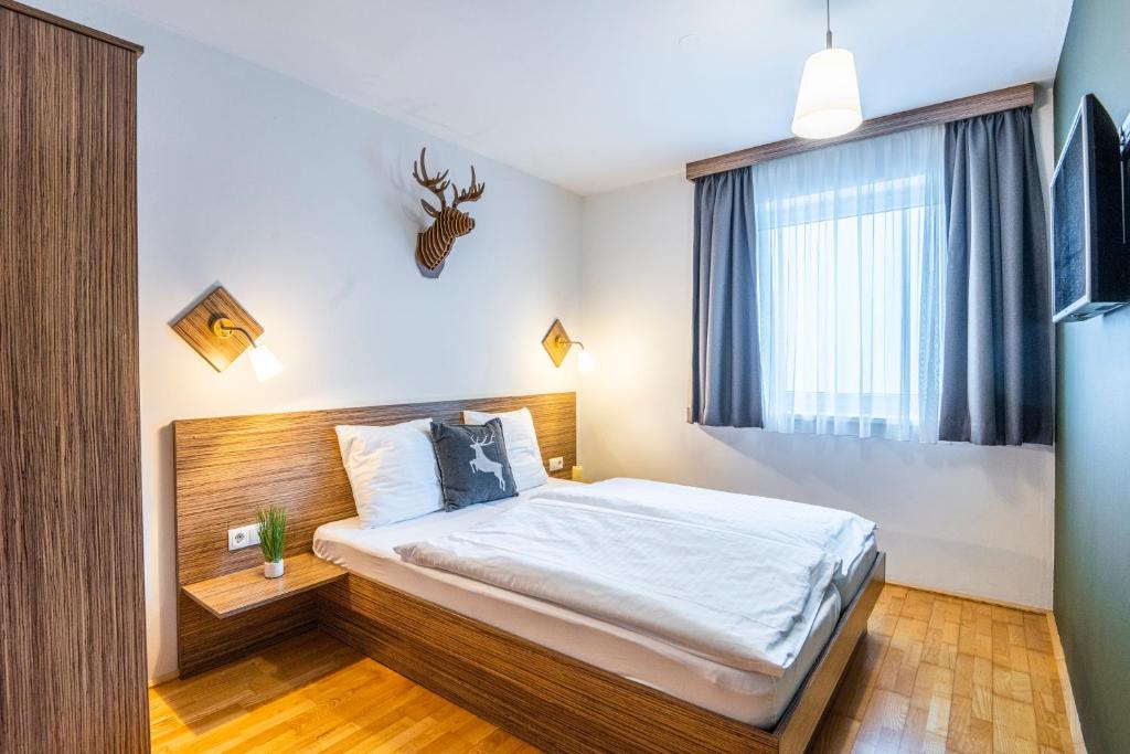 Postel nebo postele na pokoji v ubytování Haus Obauer by AlpenTravel
