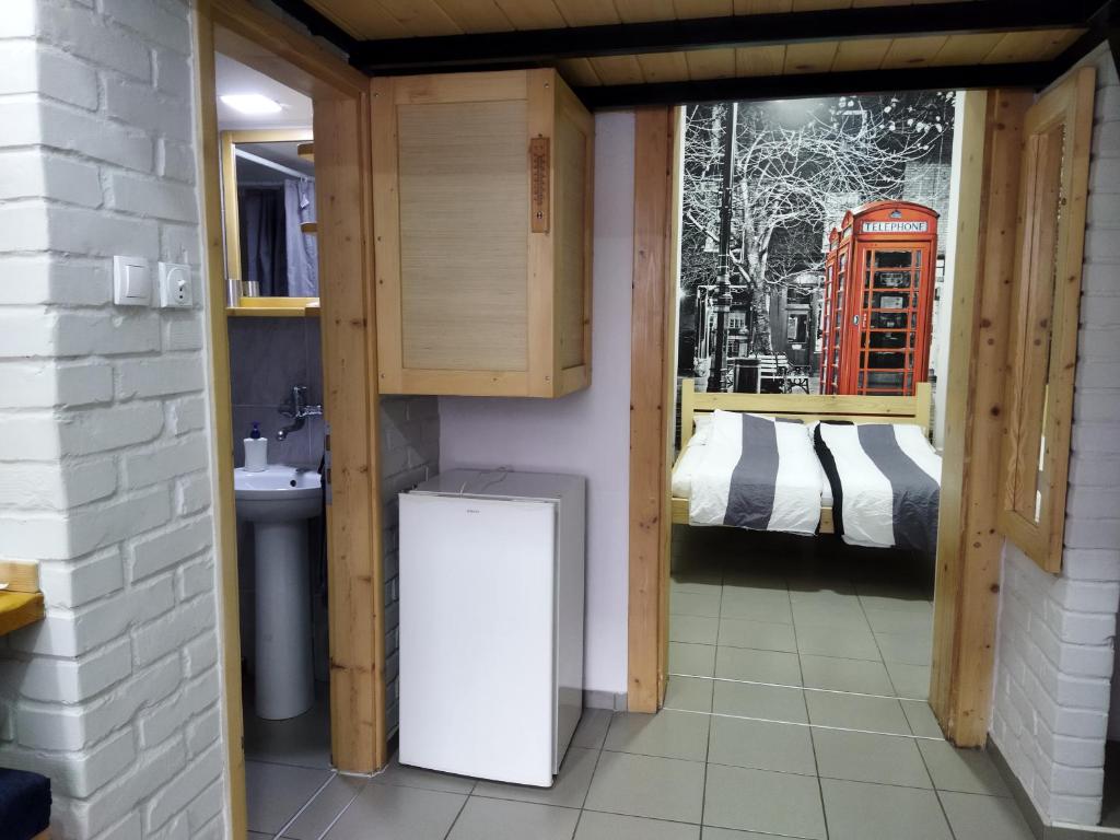 Voodi või voodid majutusasutuse Apartmani Sirmium toas