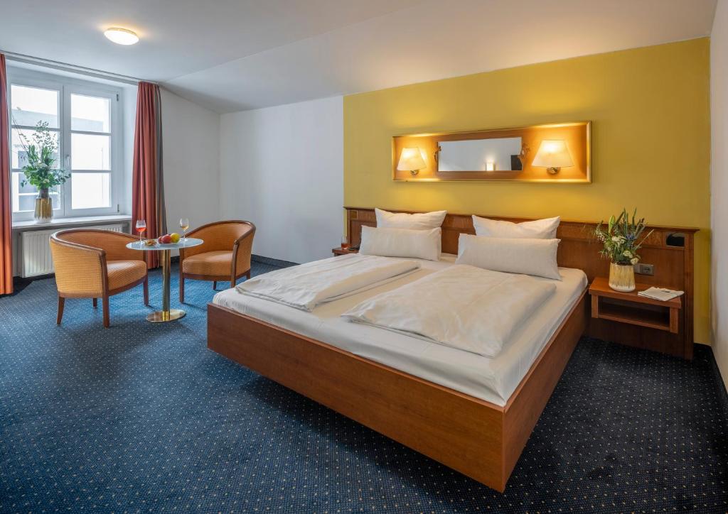Postel nebo postele na pokoji v ubytování Altstadthotel der Patrizier
