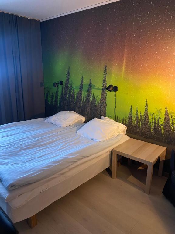 Postel nebo postele na pokoji v ubytování Hotell Smedjan