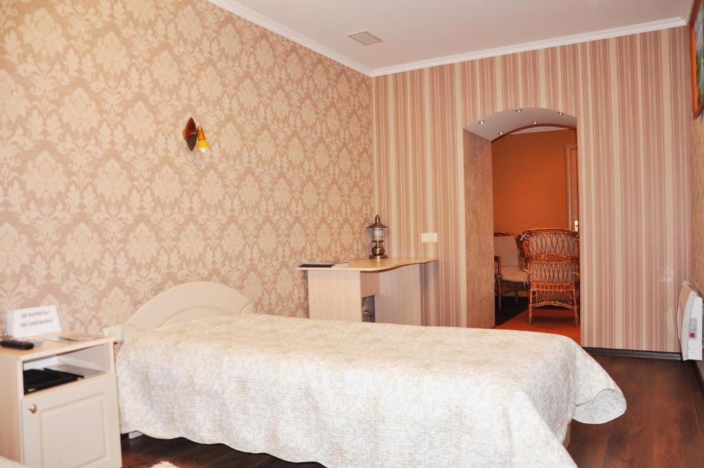 Postel nebo postele na pokoji v ubytování Evropeyskiy