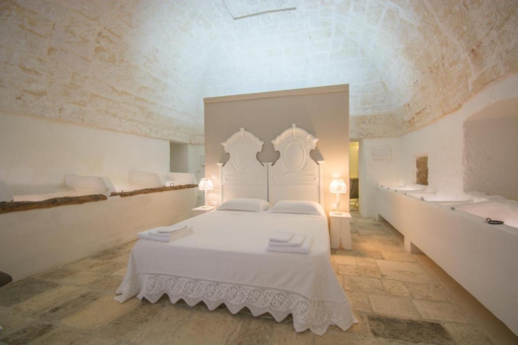 Posteľ alebo postele v izbe v ubytovaní MASSERIA SCALEDDA