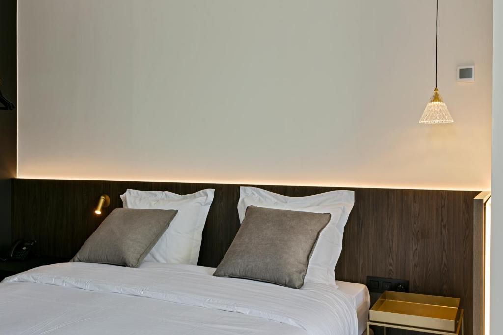 Postel nebo postele na pokoji v ubytování Hotel Astoria