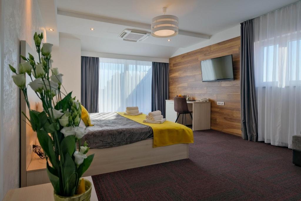 a hotel room with a bed and a tv at Hotel Bor in Krk