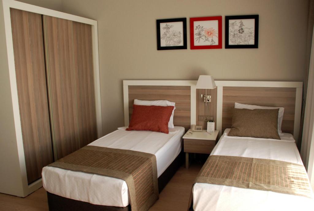 Postel nebo postele na pokoji v ubytování Port River Hotel&Spa