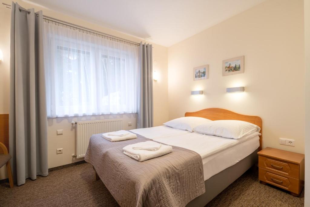 Postel nebo postele na pokoji v ubytování Willa U Jerzego