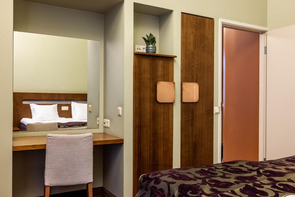 Voodi või voodid majutusasutuse Hotel Soho toas