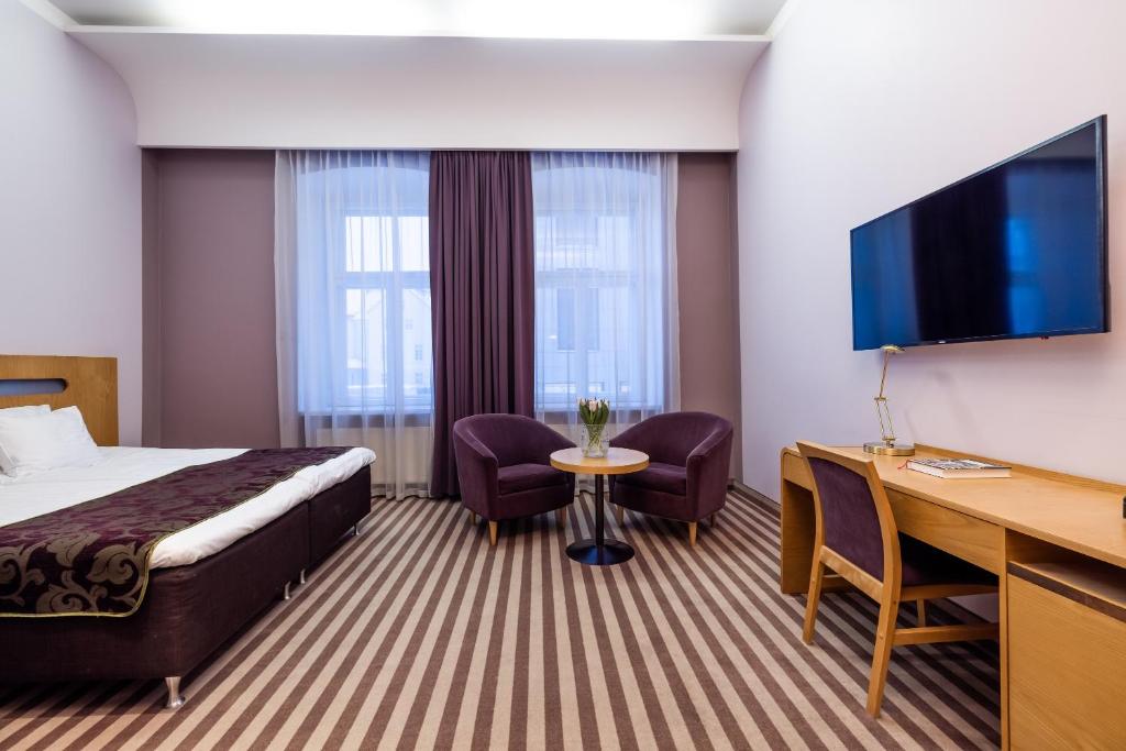 Televiisor ja/või meelelahutuskeskus majutusasutuses Hotel Soho