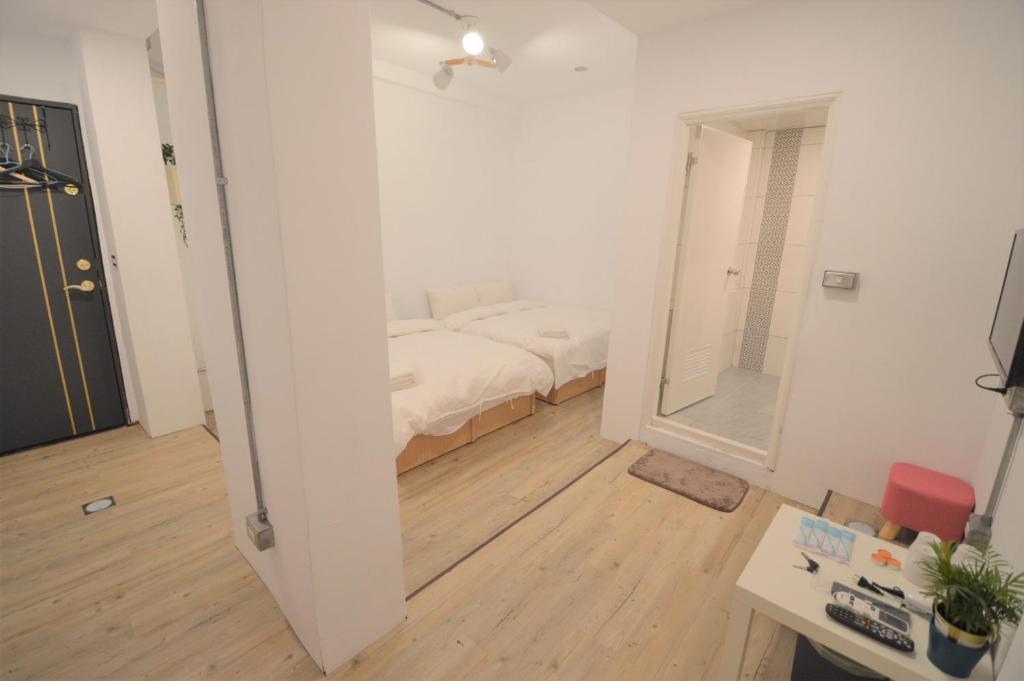 Postel nebo postele na pokoji v ubytování 小宿逢甲