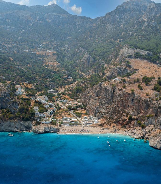 an aerial view of a beach on a mountain at Arkasa Palace in Arkasa